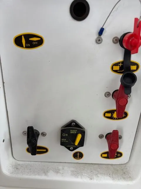 Slide: The Image of Control panel of a 2019 Beneteau Antares 27 boat with switches and labels. - 36