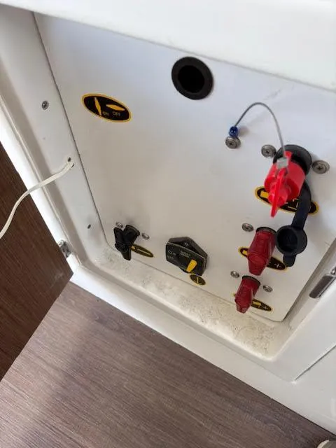 Slide: The Image of Electrical panel inside 2019 Beneteau Antares 27 boat, featuring switches and connectors. - 37