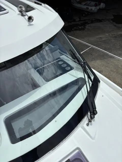 Slide: The Image of 2019 Beneteau Antares 27 boat windshield and deck details. - 45