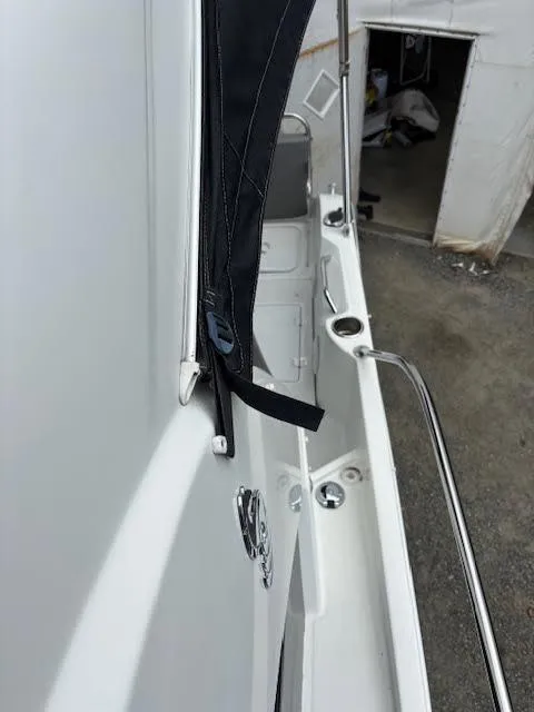 Slide: The Image of 2019 Beneteau Antares 27 boat deck with railing and cover detail. - 47