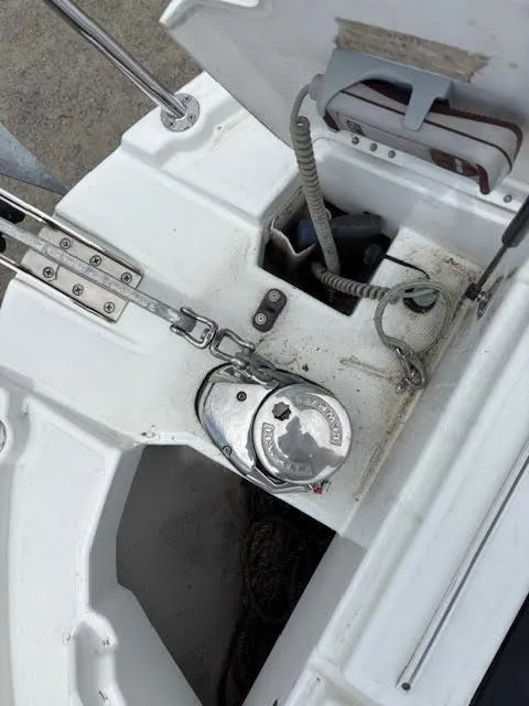 Slide: The Image of 2019 Beneteau Antares 27 boat deck with anchor winch and rope storage. - 48