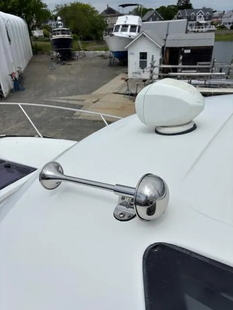 Slide: The Image of 2019 Beneteau Antares 27 boat with chrome horn and radar on deck. - 49