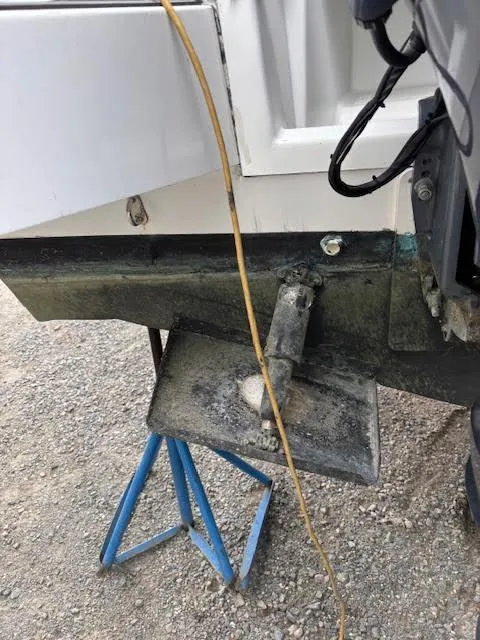 Slide: The Image of 2019 Beneteau Antares 27 boat hull on stand, showing propeller and wiring. - 5