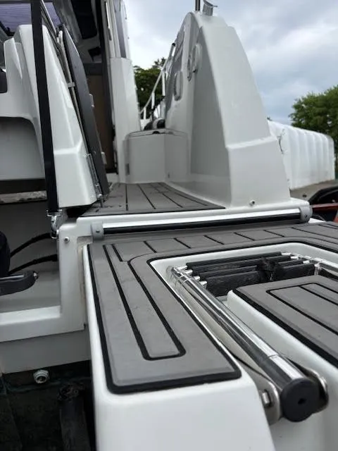 Slide: The Image of Beneteau Antares 27, 2019 model, close-up of deck and fittings, showcasing modern design. - 8