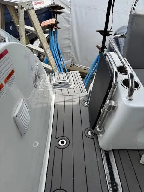 Slide: The Image of 2019 Beneteau Antares 27 boat deck with seating and safety features. - 9