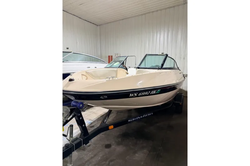Slide: The Image of 2007 Bombardier Sea-Doo Utopia 205 boat in indoor storage on trailer. - 12