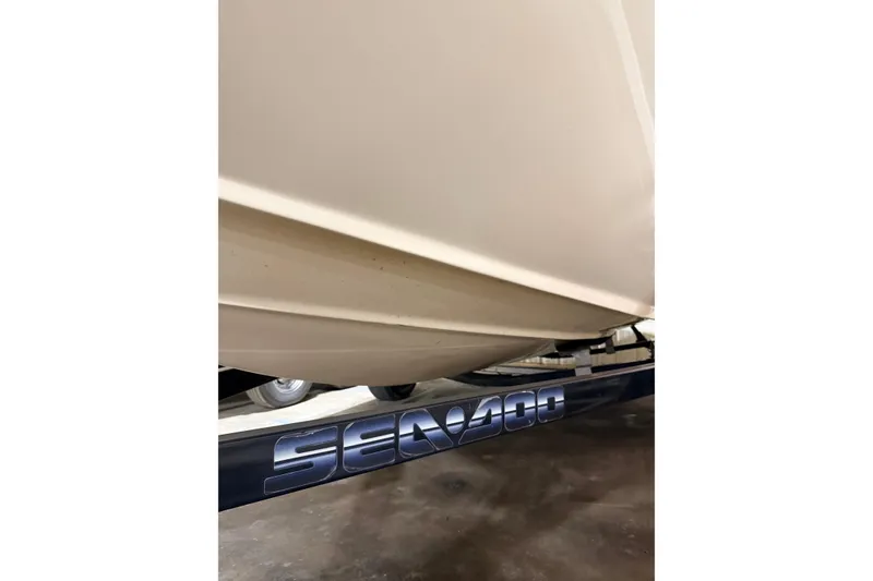 Slide: The Image of 2007 Bombardier Sea-Doo Utopia 205 boat hull on trailer, close-up view. - 13