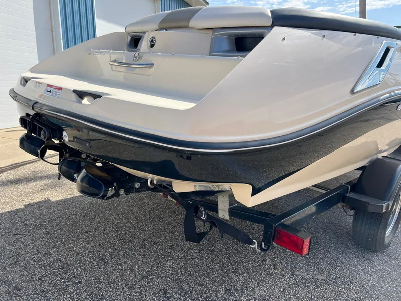 Slide: The Image of 2007 Sea-Doo 205 Utopia boat on trailer, rear view, parked outdoors. - 3