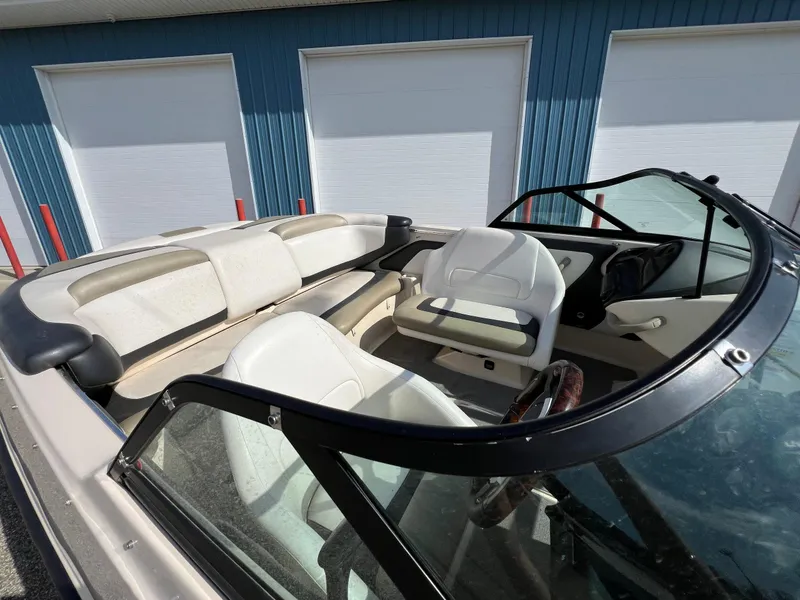Slide: The Image of 2007 Sea-Doo 205 Utopia boat interior with white seating and windshield. - 4