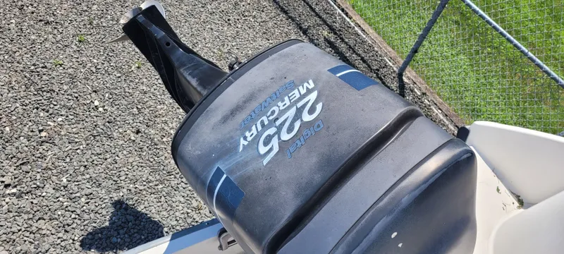 Slide: The Image of Outboard motor on a 2000 Boston Whaler 240 Outrage, featuring a 225 Mercury engine. - 13