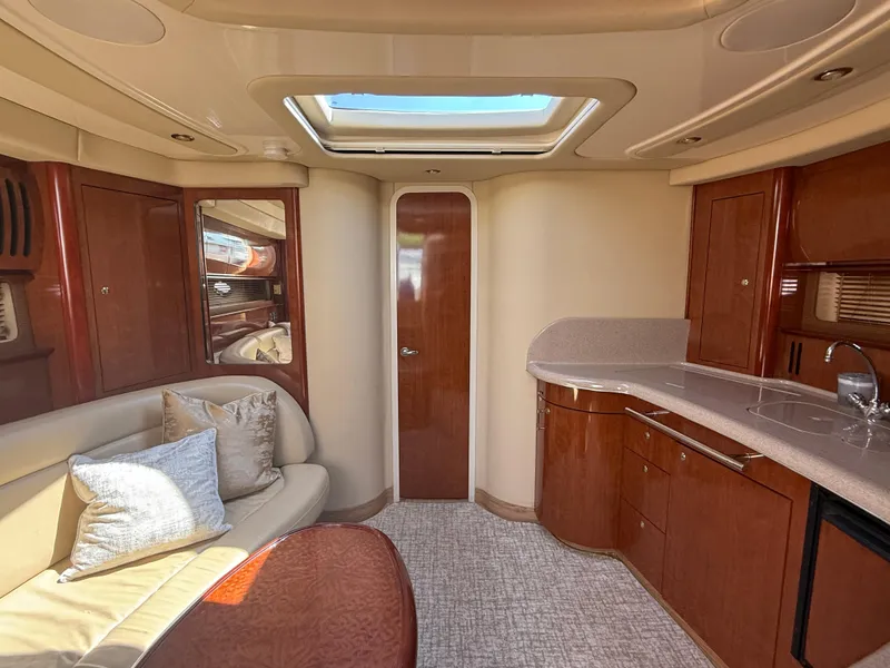 Slide: The Image of Luxurious interior of 2003 Sea Ray 420 Sundancer yacht with elegant wood finishes. - 13
