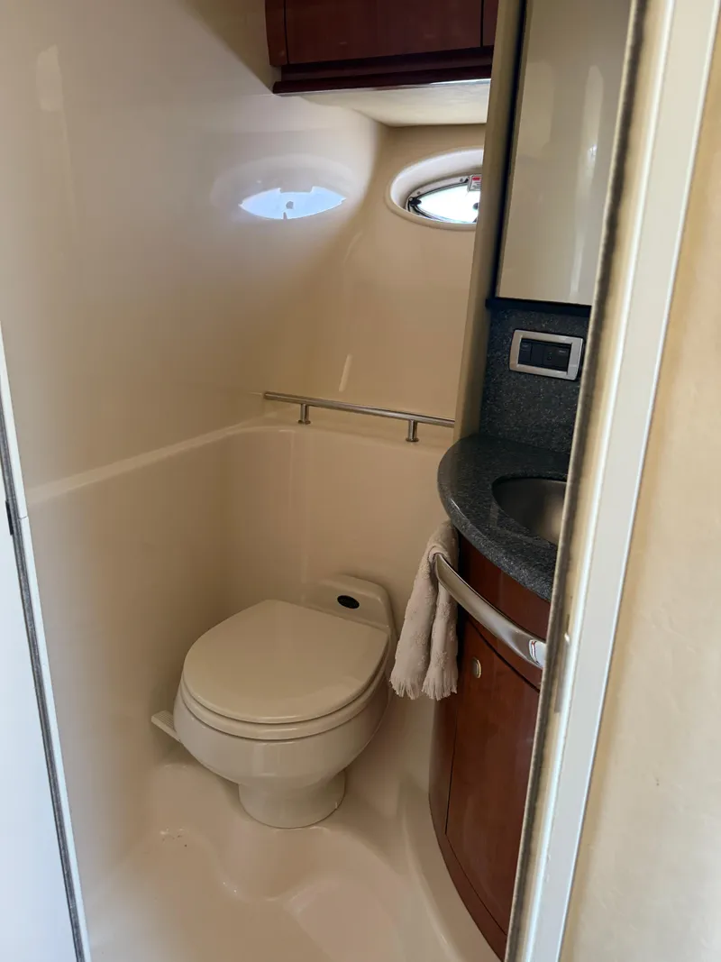Slide: The Image of 2003 Sea Ray 420 Sundancer yacht bathroom with toilet and sink. - 22