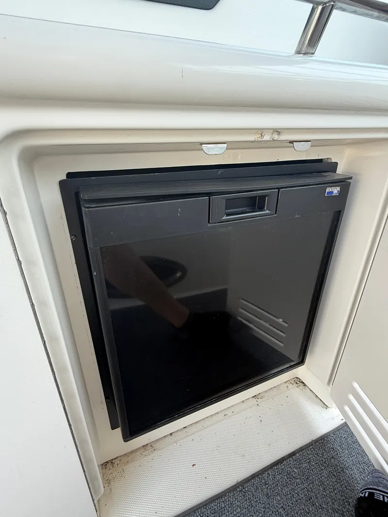 Slide: The Image of Compact refrigerator on a 2003 Sea Ray 420 Sundancer yacht. - 35