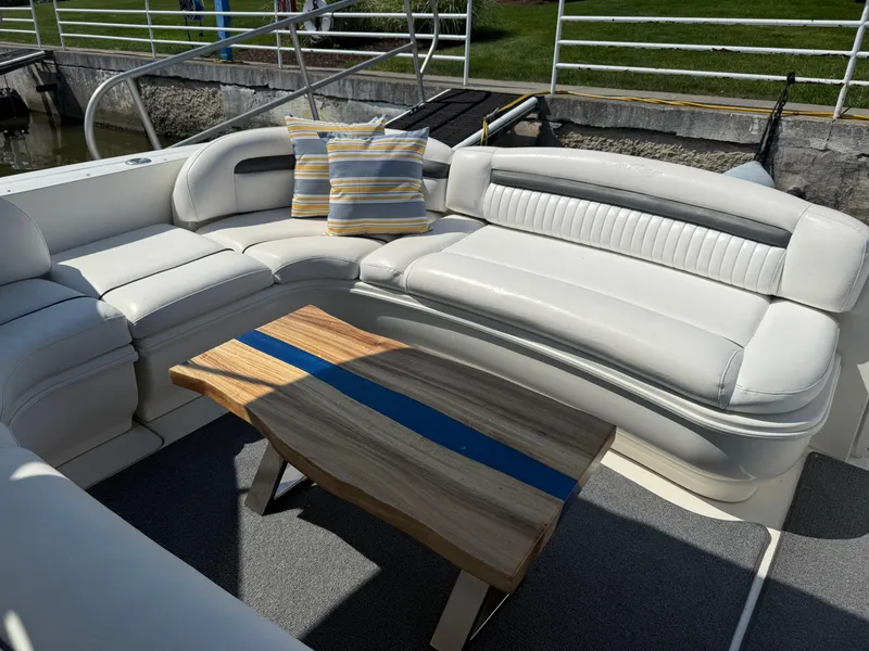 Slide: The Image of Luxurious seating area on a 2003 Sea Ray 420 Sundancer yacht with striped cushions. - 36