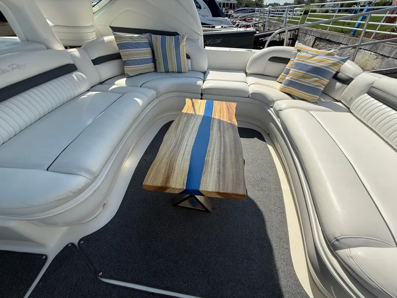 Slide: The Image of Luxurious 2003 Sea Ray 420 Sundancer interior with elegant seating and a stylish wooden table. - 38