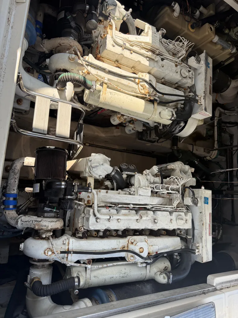 Slide: The Image of Engine room of 2003 Sea Ray 420 Sundancer with visible machinery and components. - 40