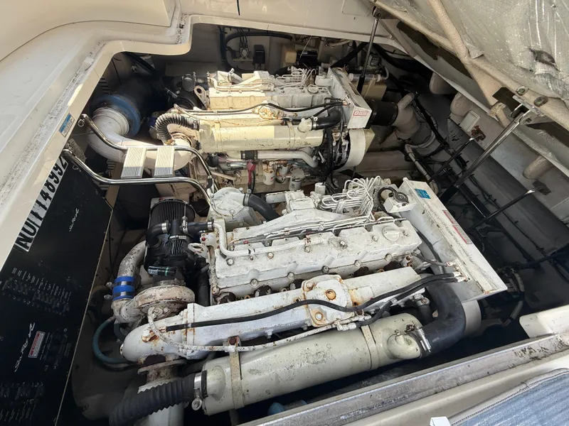 Slide: The Image of Engine compartment of a 2003 Sea Ray 420 Sundancer boat, showcasing dual engines. - 43