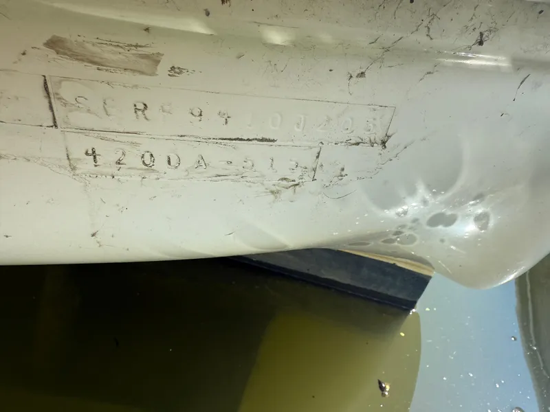 Slide: The Image of Close-up of a 2003 Sea Ray 420 Sundancer hull identification number. - 6