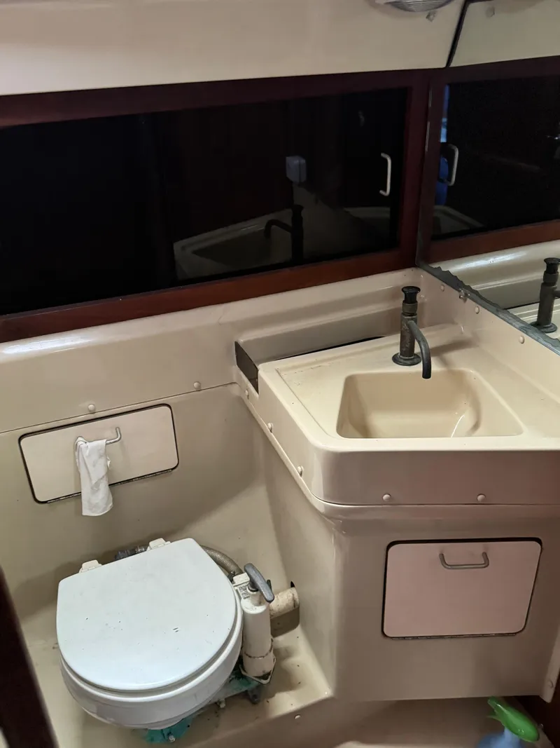 Slide: The Image of 1982 O'Day 34 sailboat bathroom with sink and toilet. - 8