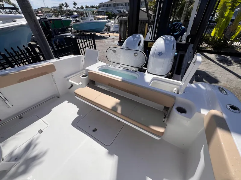 Slide: The Image of 2026 Sea Pro 262 Sport boat interior with seating and dual engines. - 11