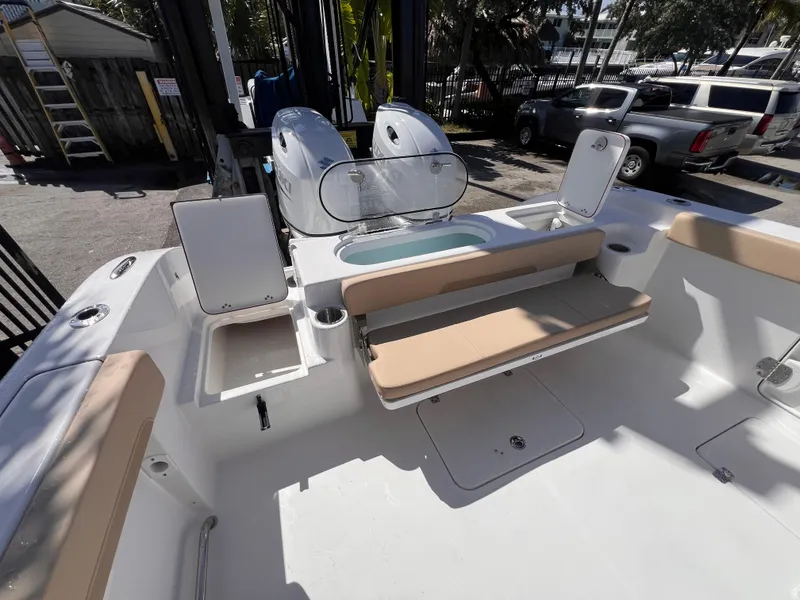 Slide: The Image of 2026 Sea Pro 262 Sport boat interior with seating and storage compartments. - 12