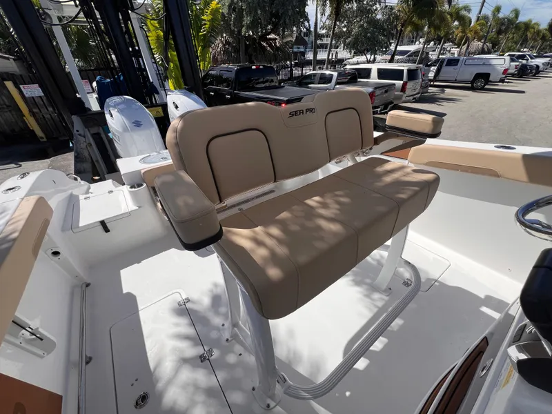 Slide: The Image of 2026 Sea Pro 262 Sport boat interior with tan seating and modern design. - 15