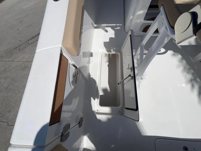 Slide: The Image of 2026 Sea Pro 262 Sport boat interior with open storage compartment. - 16