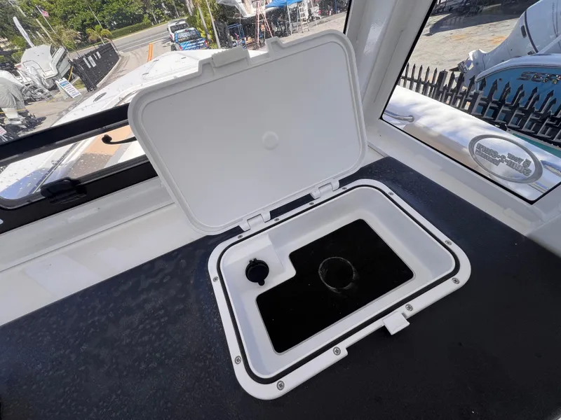 Slide: The Image of Open hatch on 2026 Sea Pro 262 Sport boat, showing storage compartment. - 23