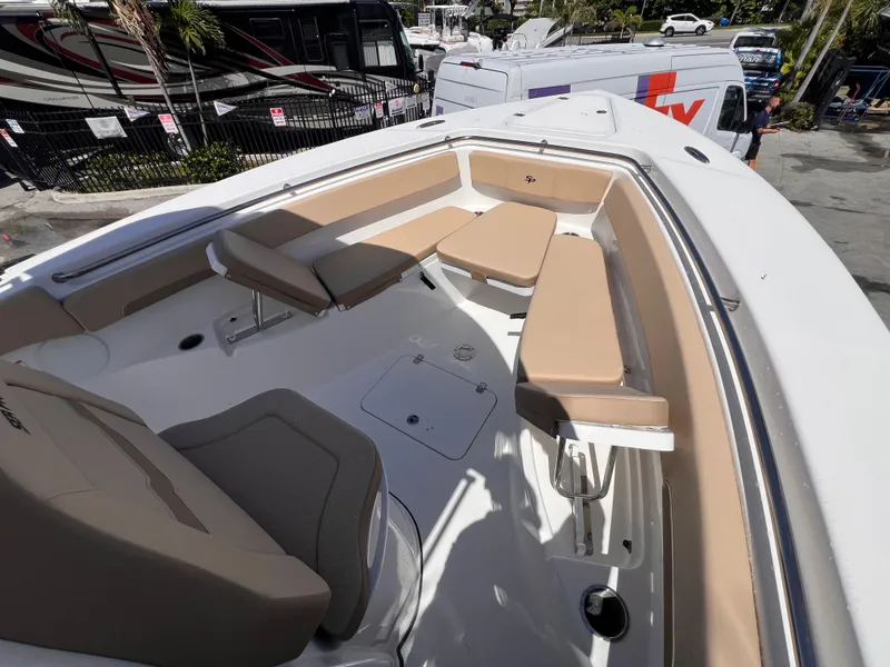 Slide: The Image of 2026 Sea Pro 262 Sport boat with tan seating and spacious deck layout. - 39