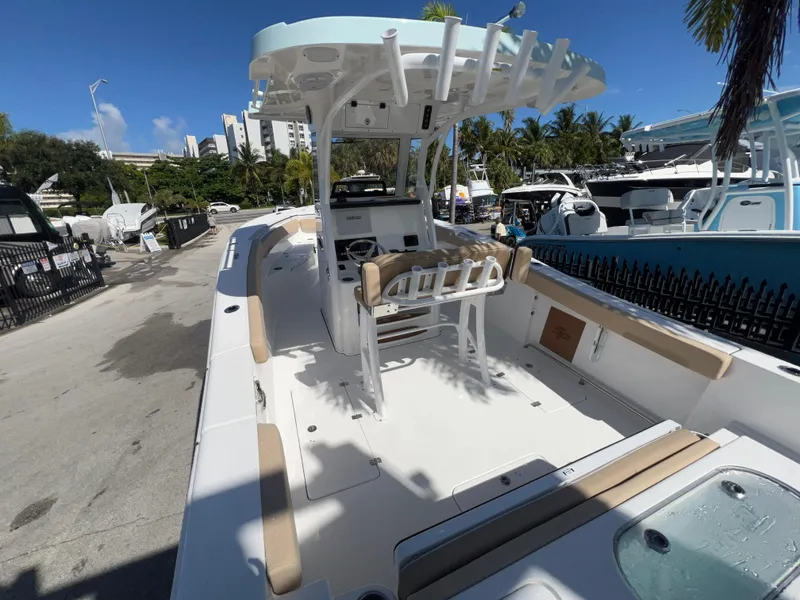 Slide: The Image of 2026 Sea Pro 262 Sport boat docked, featuring spacious deck and modern design. - 5