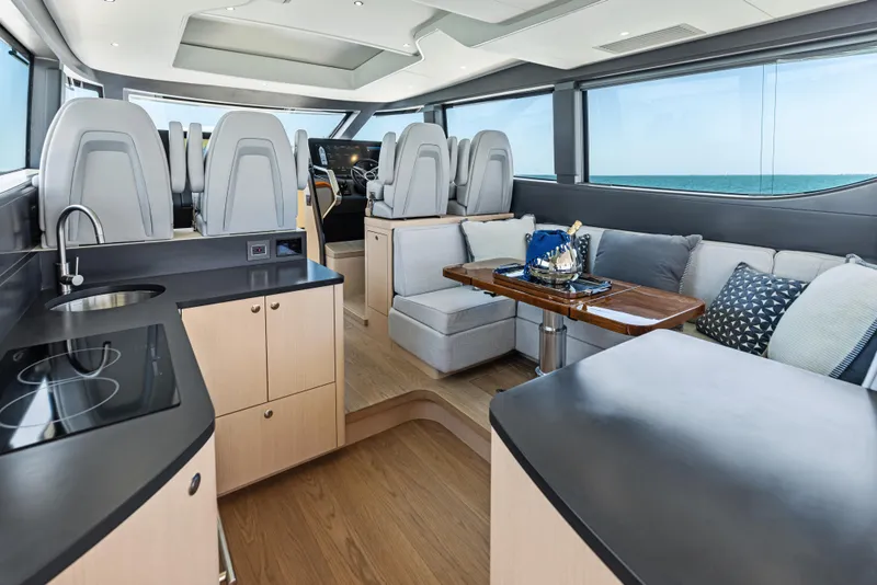 Slide: The Image of Luxurious interior of 2026 Scout 670 LXS yacht with modern kitchen and seating area. - 19