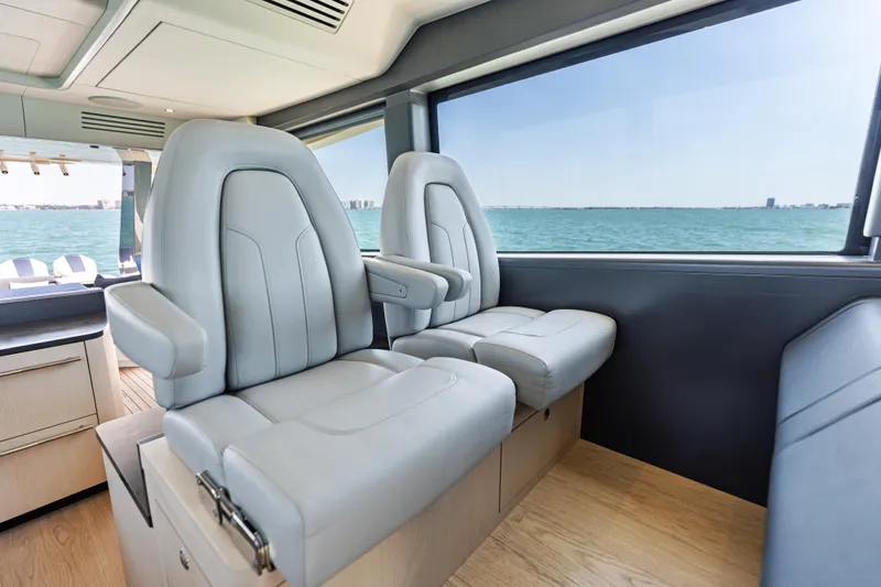 Slide: The Image of Luxurious interior seating of 2026 Scout 670 LXS boat with ocean view. - 23