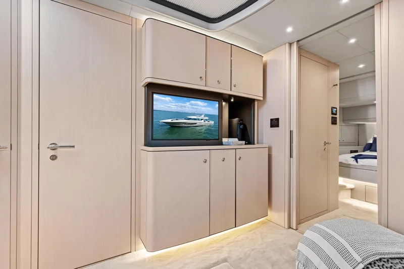 Slide: The Image of Luxurious interior of 2026 Scout 670 LXS yacht with modern cabinetry and TV. - 28