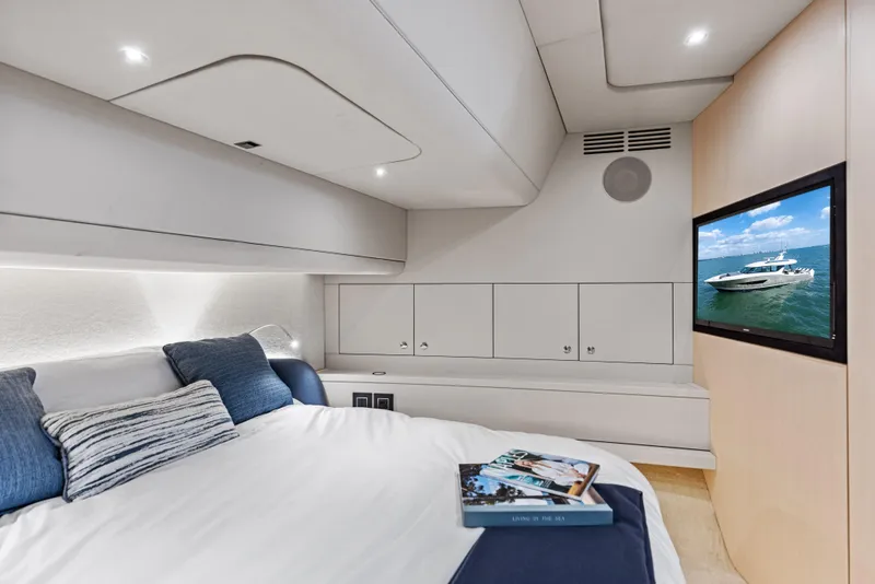 Slide: The Image of Luxurious cabin interior of 2026 Scout 670 LXS yacht with modern amenities and cozy bedding. - 29