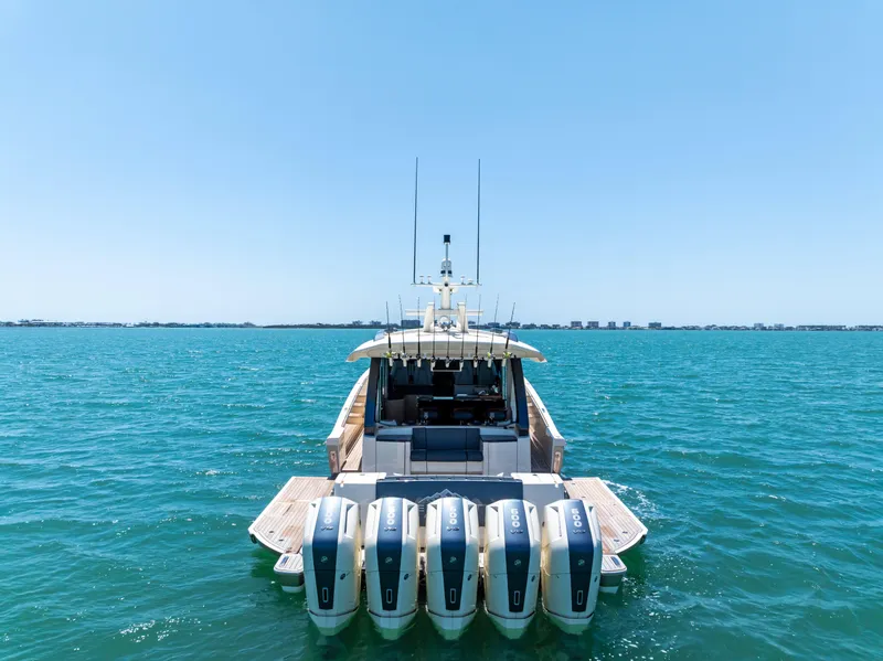 Slide: The Image of 2026 Scout 670 LXS boat with five engines on open water. - 3