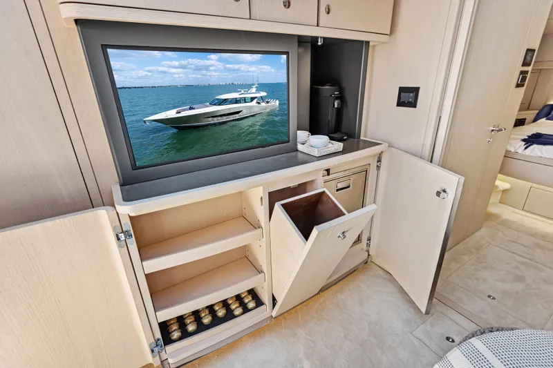 Slide: The Image of Luxurious interior of 2026 Scout 670 LXS yacht with TV and coffee station. - 33