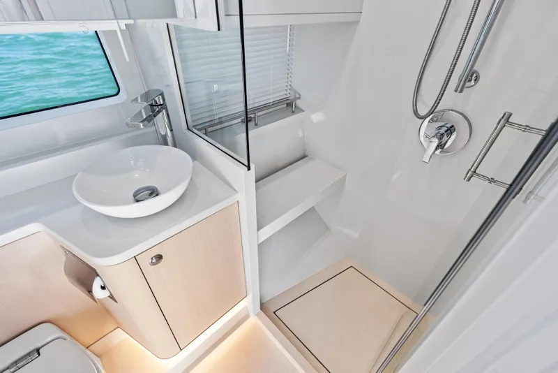 Slide: The Image of Luxurious bathroom interior of 2026 Scout 670 LXS boat with modern fixtures and ocean view. - 37