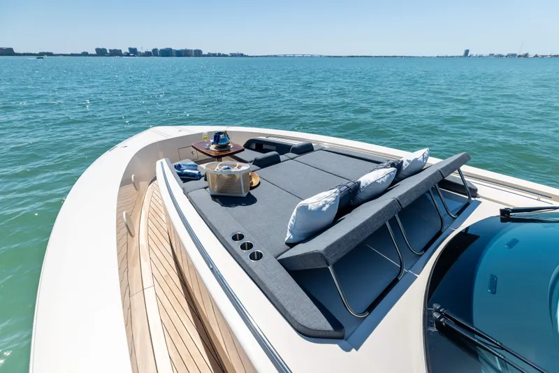 Slide: The Image of Luxurious 2026 Scout 670 LXS yacht with sunbathing deck on serene water. - 41