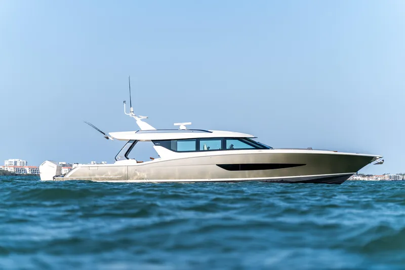 Slide: The Image of 2026 Scout 670 LXS luxury yacht cruising on open water. - 7