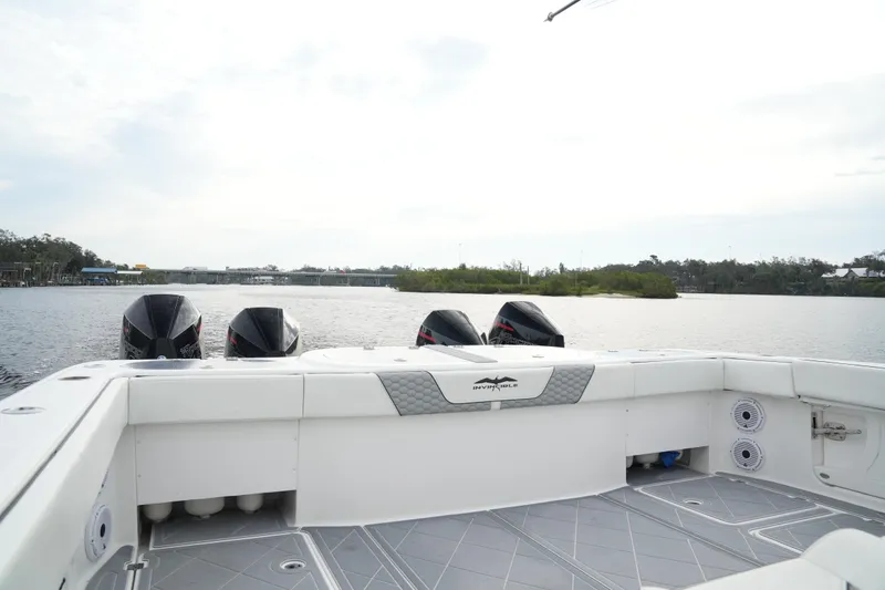 Slide: The Image of Invincible 46 Catamaran 2022 on water, showcasing powerful engines and spacious deck. - 23