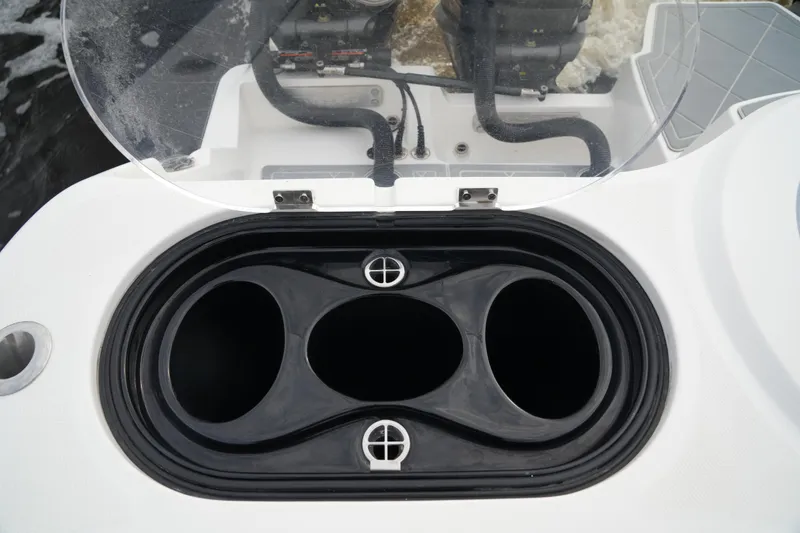 Slide: The Image of Invincible 46 Catamaran 2022, open hatch detail with visible engine components. - 29