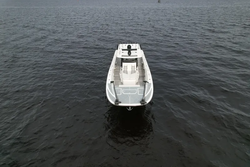 Slide: The Image of 2022 Invincible 46 Catamaran on open water, aerial view. - 7