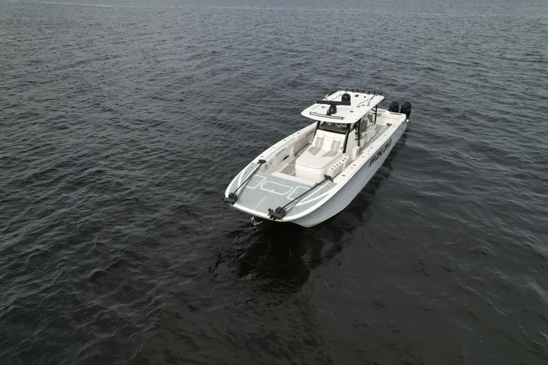 Slide: The Image of 2022 Invincible 46 Catamaran cruising on open water. - 8
