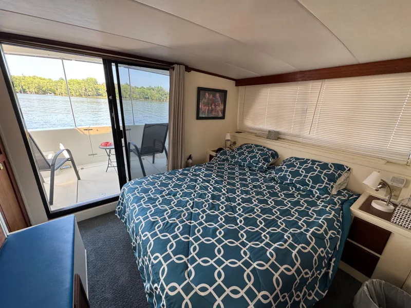 Slide: The Image of Bedroom interior of 1985 Bluewater Yachts 51 Coastal Cockpit MY with lake view. - 19