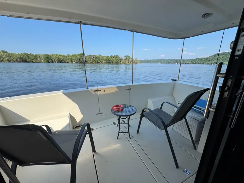 Slide: The Image of 1985 Bluewater Yachts 51 Coastal Cockpit MY, serene deck view over calm waters. - 21