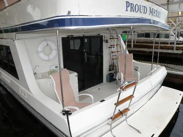 Slide: The Image of 1985 Bluewater Yachts 51 Coastal Cockpit MY docked, featuring spacious rear deck and seating. - 24