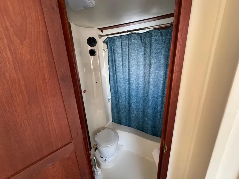 Slide: The Image of Bathroom interior of 1985 Bluewater Yachts 51 Coastal Cockpit MY with shower and toilet. - 26