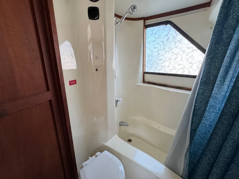 Slide: The Image of Bathroom interior of 1985 Bluewater Yachts 51 Coastal Cockpit MY with shower and window. - 28