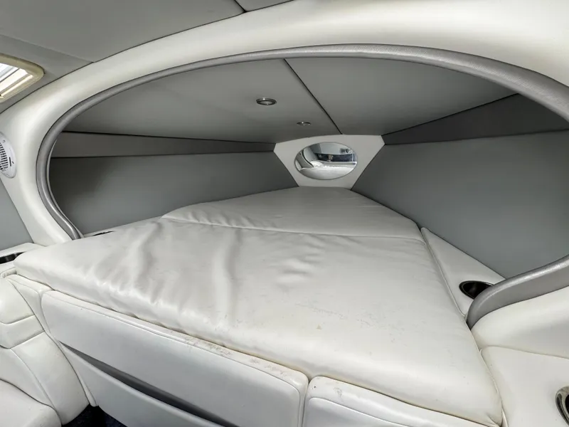 Slide: The Image of Interior cabin of a 2006 Formula 292 boat with cushioned seating. - 14