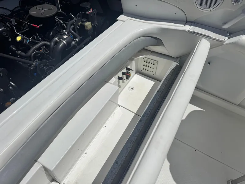 Slide: The Image of 2006 Formula 292 boat engine compartment with seating and storage area. - 25